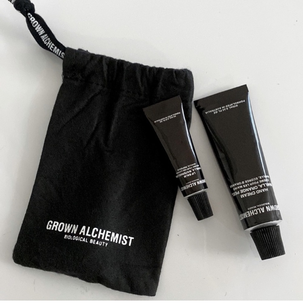 Grown Alchemist hand cream and lip balm with drawstring pouch